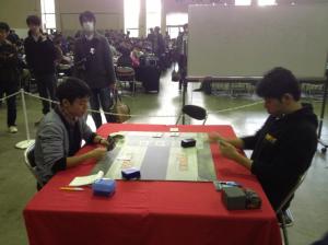 Local player Genki Yoshimura takes on Watanabe on day 2